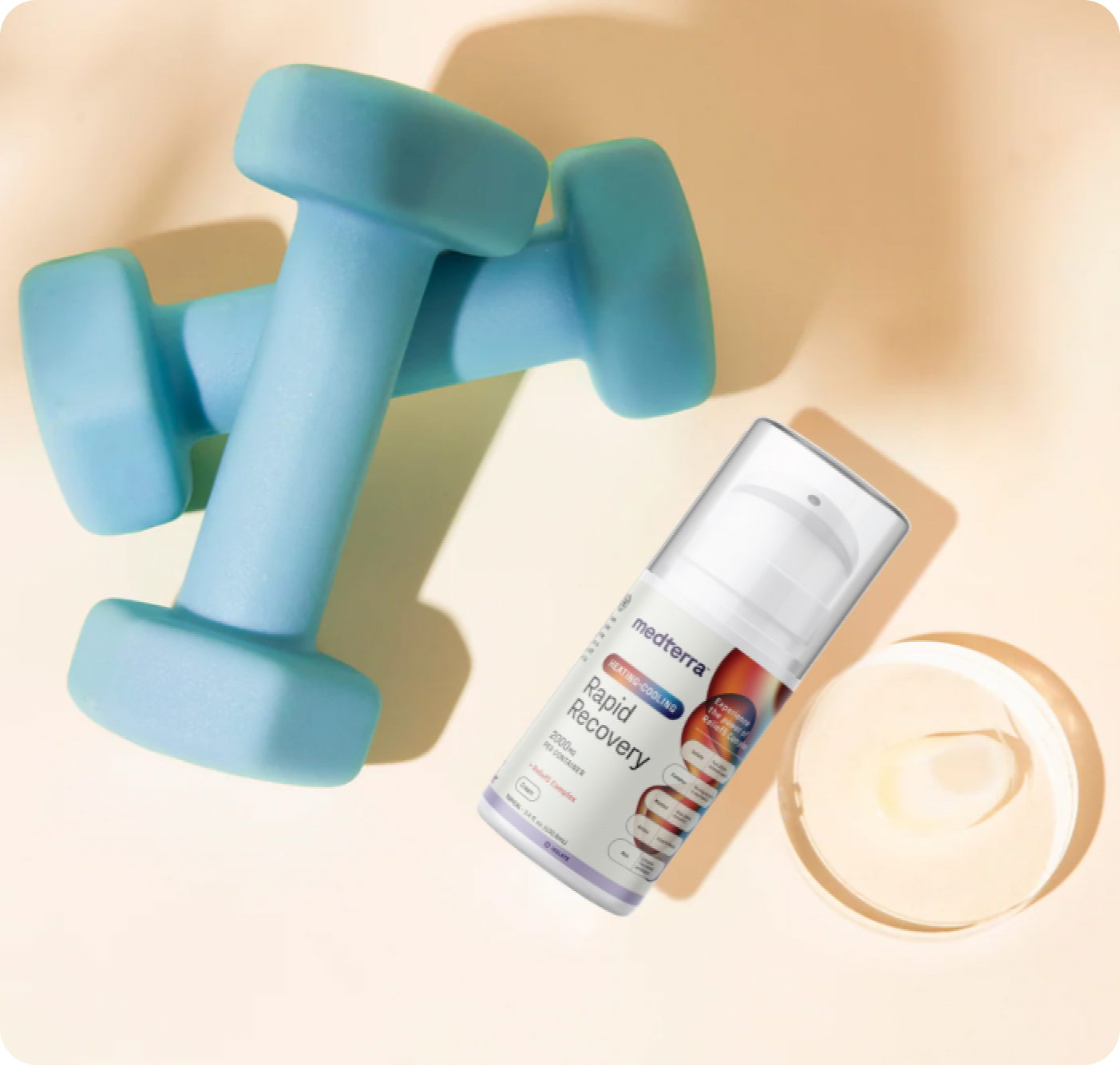 Two blue dumbbells, medterra Rapid Recovery pump bottle beside a clear dish of gel