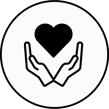 Two open hands holding a heart, symbolizing care and support.