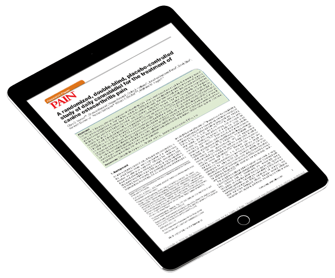 Tablet displaying a tilted research article page with bold red heading 